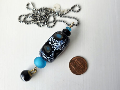 One of a kind artisan pendant features fabulous lampwork in blue and black