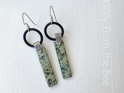 Long dangle earrings feature turquoise and sterling silver