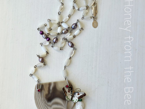 Cream and brown necklace with pops of red