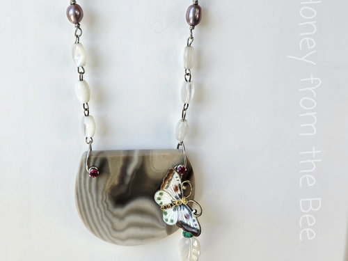 One of a kind necklace features butterfly and Polish Flint
