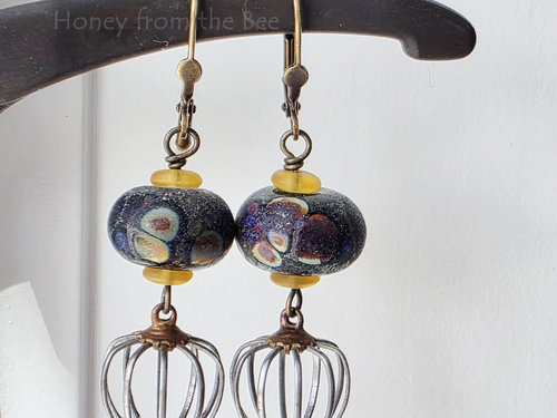 Raku lampwork earrings in black and yellow