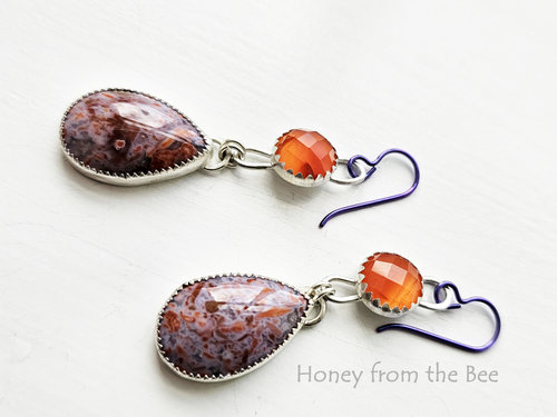 Lavender and orange gemstone drop below faceted orange gemstone earrings