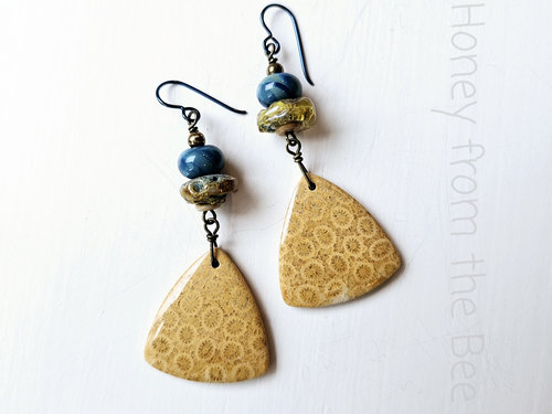 Casual earrings in blue and yellow feature lampwork and fossilized coral agate