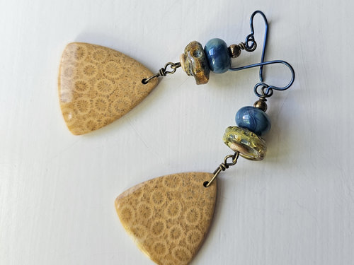 Golden fossilized coral agate earrings with blue and yellow lampwork