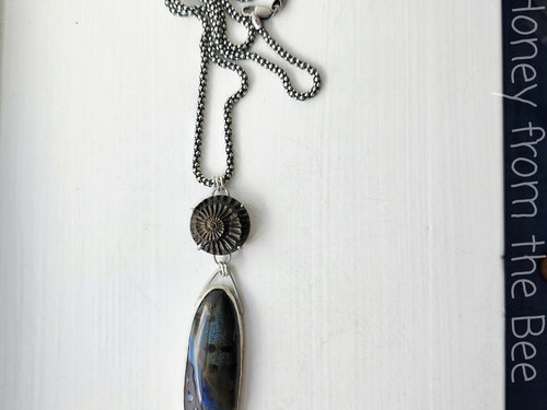 Artisan necklace features ammonite and ceramic focals