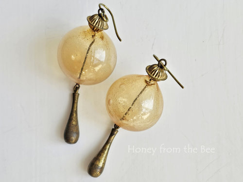 Statement earrings in yellow and aged brass