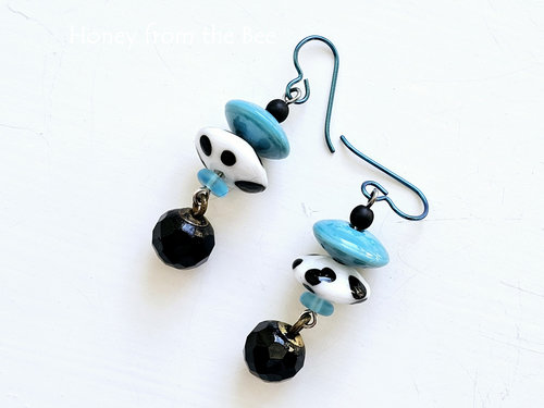 Cowgirl earrings feature lampwork and antique button dangles