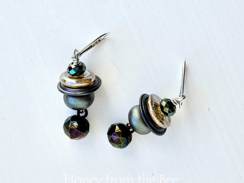 Moody earrings feature lampwork and crystal in iridescent shades