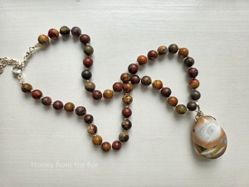 Red and brown necklace features jasper gemstones