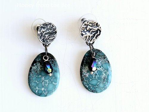 Turquoise earrings feature reticulated silver posts