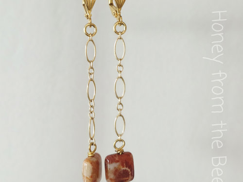 Long dangle earrings in red and gold