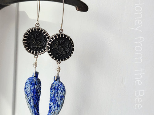 Feather earrings in blue, black and silver
