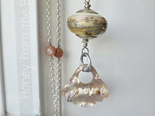 Iridescent lampwork focal necklace with peach moonstone and sterling silver