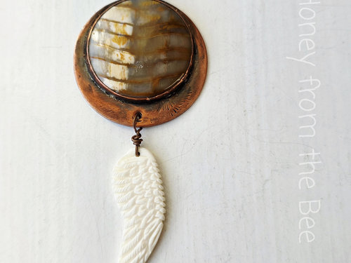 Angel wing pendant with copper and petrified wood focal