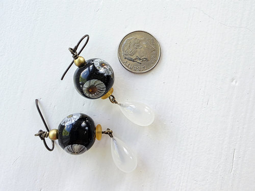 Floral earrings feature daisy lampwork and vintage glass drop