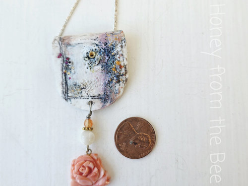 Floral pendant in white, coral and purple