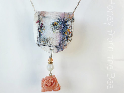Floral necklace in white, coral and purple