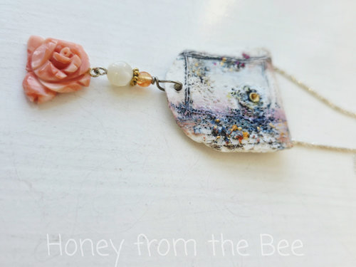 Feminine necklace with ceramic focal and coral rose