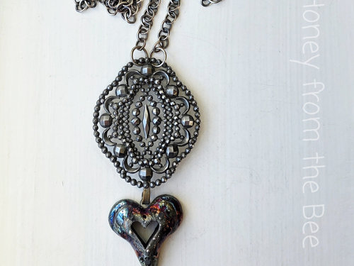 Gothic style necklace features heart in raku
