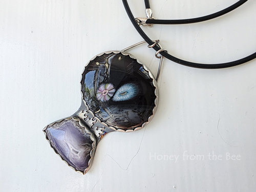 Outer Space inspired necklace featuring art glass in black with purple and blue accents and Casa Grande Agate