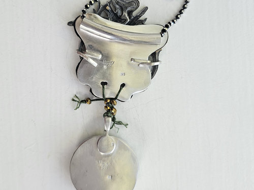 Back of sterling silver artisan pendant
