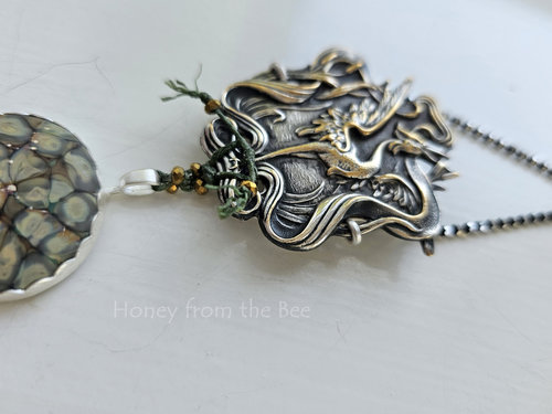 Art Nouveau crane pressing set in sterling silver as a pendant