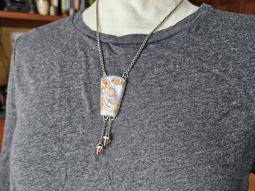 Ocean jasper necklace with sunstone drops set in sterling silver on model.