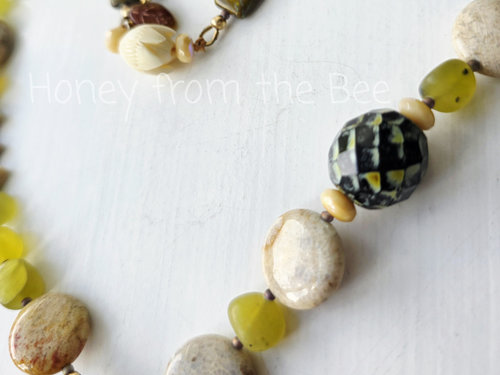 Green and cream artisan necklace in garden theme