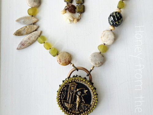 Garden theme necklace in green, cream and gold