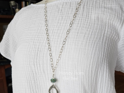 Tunic length pendant on model