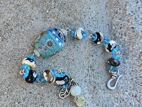 Soothing blues and greens are the color scheme of this bead bracelet.