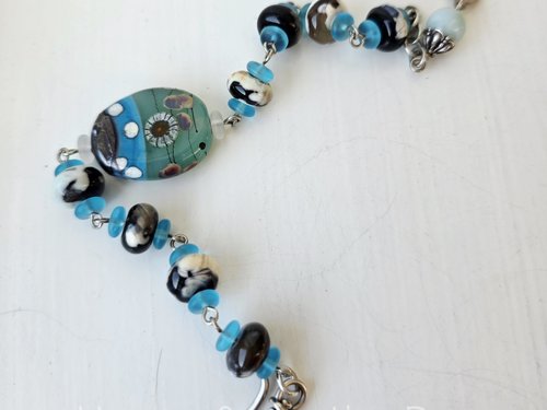 Lampwork bracelet with aquatic theme in aqua, black and cream