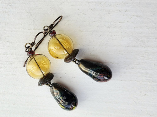 Hollow glass earrings with ceramic drops