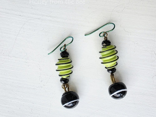 Lampwork earrings in light green and black