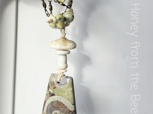 Nature inspired necklace features mushroom rhyolite and mushroom lampwork