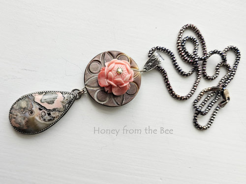 Lotus flower in peach against grey mother of pearl antique button with grey and peach gemstone drop pendant necklace