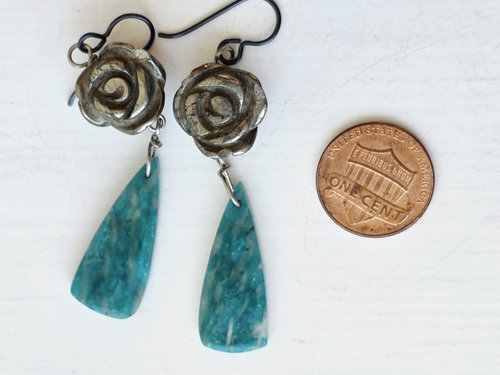 Silver rose earrings with green gemstone dangle
