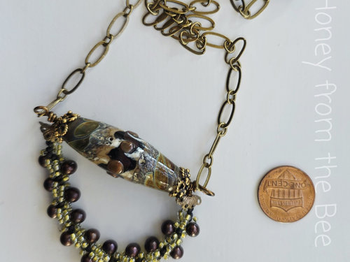 Boho necklace in browns and brass