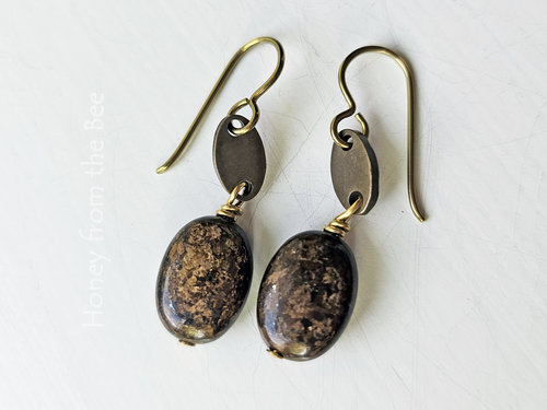 Brown gemstone earrings with flecks of gold