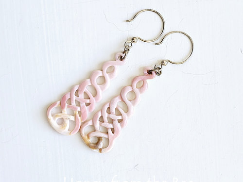 Long pink earrings in Celtic knot motif in shell