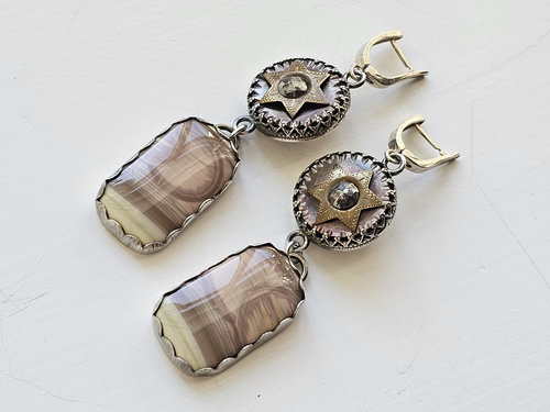 One of a kind earrings feature antique buttons with star motif and imperial jasper with moon motif