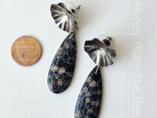 Teardrop gemstone with silver flower