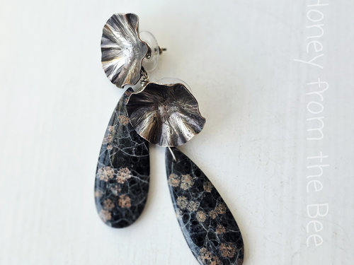 Flower earrings feature sterling silver and black gemstone
