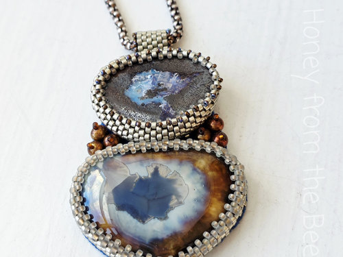 Boulder Opal pendant is bead embroidered with ceramic focal