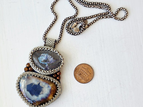 Bead embroidered pendant features boulder opal, pearls and ceramic