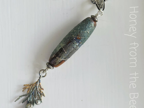 Sterling Silver pendant with lampwork in a forest theme