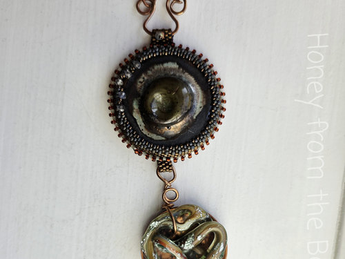Statement pendant in copper, ceramic and glass