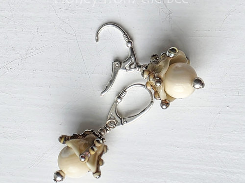 Lampwork earrings in cream and silver are inspired by the ocean