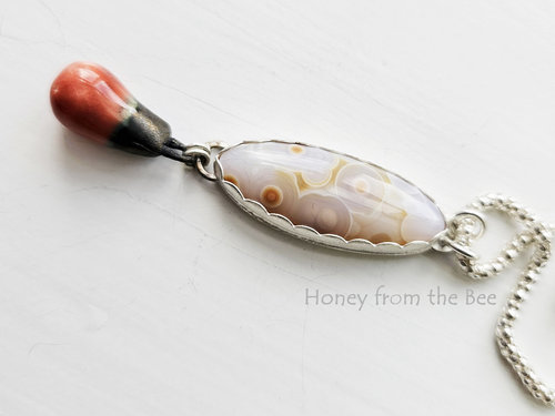 Old stock ocean jasper in white and orange with orange ceramic drop pendant necklace