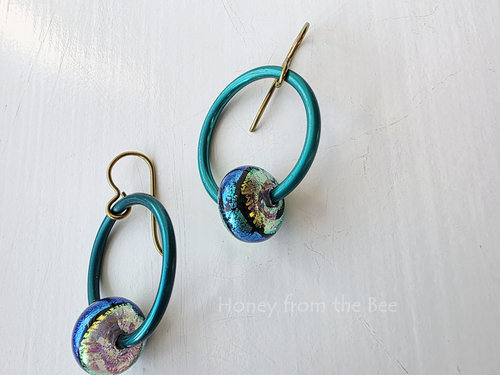 Dichroic glass in teal and chartreuse are part of teal hoop earrings